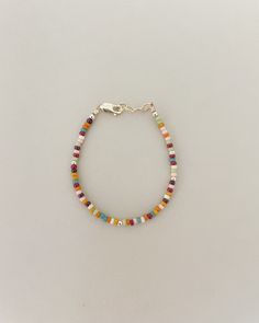 2mm beautiful rainbow dainty beads will be your new favorite layer bracelet this year! The warm and pretty tones of the rainbow beads will have you fall in love with the detail!  This beautiful Handmade bracelet is a perfect gift for anyone! Mamas, toddlers and children love these bracelets made to last. Order a matching bracelet for you and your little ones. Our Bracelets are Handmade in the USA and are made with high quality 14K gold filled attachments. They are beautiful and add the perfect a Multicolor Round Bead Friendship Bracelets For Everyday, Adjustable Multicolor Tiny Beads Jewelry, Multicolor Friendship Bracelets With Round Beads For Everyday, Everyday Multicolor Friendship Bracelets With Round Beads, Adjustable Rainbow Jewelry With Tiny Beads, Bohemian Heishi Beads Friendship Bracelets, Handmade Minimalist Multicolor Beaded Bracelets, Multicolor Handmade Minimalist Beaded Bracelets, Everyday Multicolor Heishi Beads Jewelry