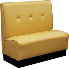 a yellow leather couch with black legs and buttons on it's armrests