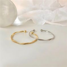 ✦ Our Simple Gold Wave Open Cuff Bangle Bracelet is a dainty and stylish accessory perfect for everyday wear. Crafted from high-quality materials and plated with a shiny gold finish, this bracelet features a unique wave design and an open cuff for comfortable wear. It makes a thoughtful gift for her, best friend or as a couple bracelet. ----------- DETAILS ------------ Diameter: 6.2cm- Size: Adjustable - Color: Gold/ Silver- Materials: Alloy, Gold Plating- SKU: HB637 Minimalist Gold Metal Cuff Bracelet, Trendy Gold Bangle Bracelet For Formal Occasions, Trendy Tarnish-resistant Cuff Bangle, Trendy Tarnish-resistant Cuff Bracelet Bangle, Trendy Tarnish Resistant Cuff Bracelet Bangle, Trendy Gold-plated Tarnish-resistant Bangle, Modern Silver Gold-plated Bangle, Trendy Tarnish-resistant Metal Cuff Bracelet, Trendy Metal Cuff Bracelet Tarnish Resistant