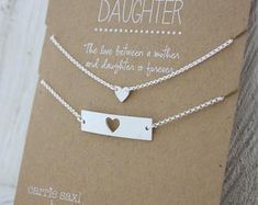 two personalized necklaces with heart and bar on each side, one is for daughter