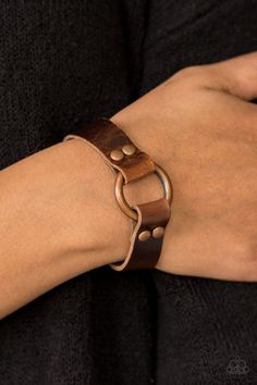 Shiny strips of brown leather loop around a shimmery copper hoop, creating an urban centerpiece. Features an adjustable snap closure. Sold as one individual bracelet. P9UR-CPXX-022XX Cheap Trendy Leather Bracelet For Parties, Cheap Casual Brown Leather Bracelet, Leather Wristbands Wrap, Luxury Leather Bracelets With Brass Hardware, Luxury Waxed Leather Bracelet, Affordable Adjustable Leather Bracelet, Casual Everyday Affordable Leather Bracelet, Clasps For Leather Bracelets, Leather Cord Bracelets Women