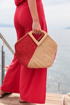 Stand out from the crowd this summer with Shiraleah's Jazz Mini Tote. This classic woven jute bag features a chic triangular top handle and both pink and red design for an extra pop of color. Pair with other items from Shiraleah to complete your look! Features a top handle and trendy multicolor design Shiraleah is a trend-driven lifestyle brand focused on the little gifts that make life special! Made from jute Measures L 16" x w 8" x h 12" Made in india Chic Summer Crochet Bag With Top Handle, Chic Summer Crochet Top Handle Bag, Chic Crochet Bag With Top Handle For Summer, Chic Crochet Top Handle Bag For Summer, Chic Summer Crochet Bag With Leather Handles, Summer Straw Bag With Leather Handles For Day Out, Summer Top Handle Crochet Shopping Bag, Red Beach Bag For Spring, Chic Red Woven Straw Bag