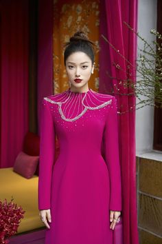 Indulge in pure luxury with our Ao Dai. The rich, velvety texture combined with the elegant high neck design and floor length cut exude sophistication and exclusivity. Elevate your style and make a statement with this exquisite piece. Length: 150cm (Ao Dai), 110cm (Pants) Elegant High Neck Wedding Evening Dress, Luxury Festive Gown For Banquet, Luxury Festive Evening Dress, Luxury Fitted Velvet Gown, Luxury Velvet Floor-length Evening Dress, Elegant Ball Gown For Reception, Elegant Evening Dress With Sweep Train For Reception, Luxury Velvet Gown, Elegant Floor-length Evening Dress For Reception