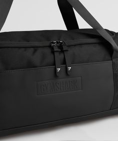 Gymshark Small Everyday Gym Bag - Black Durable Black Gym Bag For Sports, Waterproof Rectangular Gym Bag For Everyday Use, Rectangular Waterproof Gym Bag For Everyday Use, Sporty Everyday Bags With Functional Pockets, Functional Travel Bag For Everyday Use, Black Waterproof Gym Bag, Durable Black Sporty Gym Bag, Waterproof Sports Backpack, Waterproof Black Rectangular Gym Bag