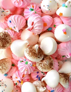 pink and white candies with sprinkles on them