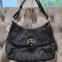 Nwt Coach Soho Signature Black/Silver Flap Duffle Bag 23164e Never Used, Tags Still Attached. Great Gift For A Birthday, Anniversary Or Mothers Day. I Will Include A Dust Cover, If You Don't Ask Me To Drop My Price. Perfect For That Fashionista Or Timeless Zipper At The Top With Coach Hang Tag, Adjustable Strap, Can Be Longer Or A Shoulder Bag. Front Flap With Pocket - 2 Interior Wall Pockets Without Zipper- 1 Interior Wall Pocket With Zipper - Purple Lining Bag Height: 9.5" Bag Length: 13.25" B Hang Bag, 65th Anniversary, Pocket With Zipper, Coach Bag, Wall Pockets, Interior Wall, Nice Things, Dust Cover, Flap Bag