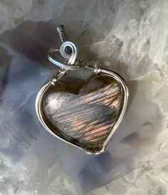 Labradorite Heart wrapped in 925 sterling silver Adjustable Silver Heart Cut Jewelry, Artisan Silver Heart-shaped Jewelry, Artisan Jewelry With Heart Charm As Gift, Artisan Silver Heart Jewelry, Artisan Jewelry With Heart Charm For Gift, Unique Handmade Heart Cut Jewelry, Artisan Pendant Jewelry For Valentine's Day, Artisan Heart-shaped Silver Jewelry, Unique Handmade Open Heart Jewelry