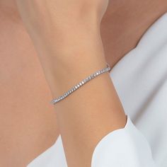 Experience timeless elegance with our Sterling Silver 2mm Fine Tennis Bracelet! Made with high-quality sterling silver, this delicate bracelet is perfect for everyday wear or special occasions. Its 2mm width adds a touch of sophistication to any outfit. Feel confident and stylish with this must-have accessory! 100% Fine Sterling Silver Silver Tennis Bracelet, Gifts For Swimmers, Artisan Gift, Grandmother Gifts, Zodiac Jewelry, Solid Gold Jewelry, Tennis Bracelet, Gifts For Mum, Inspirational Gifts