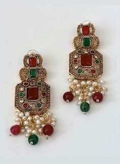 A light weight, south asian inspired multi-color stone earrings which will perfectly elevate any style. Made with exquisite materials, these minimalistic pearl earrings are a perfect blend of sophistication, elegance and durability. Due to the one-of-a-kind nature of the medium, exact colors and patterns may vary slightly from the image shown. Measurements (L x W): 3 inches x 1 inches Estimated Delivery: 3-4 Days. Elegant Festive Beaded Earrings, Bohemian Earrings With Stone Work For Festive Occasions, Elegant Pearl Earrings With Stone Work, Elegant Red Earrings With Stone Work, Elegant Stone Work Pearl Earrings, Elegant Green Chandelier Earrings With Stone Work, Elegant Chandbali Beaded Earrings As Gift, Elegant Pearl Drop Beaded Earrings For Festive Occasions, Elegant Multicolor Pearl Earrings For Celebration