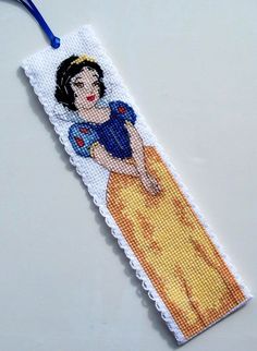 a cross stitch bookmark with an image of snow white on it