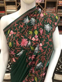 A Marvellous Embroidered Kashmiri Saree which you can wear at any party or a wedding.- - - - - - - - - - - - - - - - - - - - Product DetailsCondition: Brand NewKashmiri Saree with Multi-Colour Aari Embroidery.Colour: GreenF A B R I CSaree: Semi-CrepeBlouse: Semi-CrepeF I N I S H- UnstitchedYou can get it stitched locally.- StitchedWant your blouse ready to wear, let us know the style you want and we will stitch it for you.***PLEASE NOTE: We would require you to share certain precise body measure Green Salwar Kameez With Floral Embroidery, Embroidered Anarkali Traditional Wear For Festivals, Floral Embroidered Dress For Eid, Green Embroidered Zari Work Dress For Wedding, Green Traditional Wear With Floral Embroidery For Diwali, Green Dress With Chikankari Embroidery In Traditional Drape, Green Embroidered Dress With Zari Work For Wedding, Green Dress With Chikankari Embroidery, Traditional Drape, Traditional Chanderi Dress With Floral Embroidery