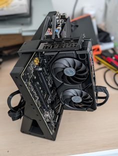 the inside of a computer case sitting on top of a desk