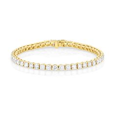 Named after tennis player Billie Jean King, this bracelet is a timeless addition to any fine jewelry collection. Each of the 48 round natural diamonds is hand selected and four prong set for a classic yet bold statement. Classic Gold Bracelet With Brilliant Cut, Timeless Gold Bracelet With Brilliant Cut Diamonds, Classic Diamond Tennis Bracelet With Accents, Timeless Diamond Tennis Bangle Bracelet, Classic Round Gold Bracelet With Diamonds, Classic Gold Bracelet With Diamonds, Classic White Gold Bracelet With Prong Setting, Classic Cubic Zirconia Tennis Bangle Bracelet, Classic Gold Diamond Bracelet With Round Cut