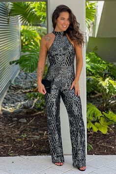 Black Sequined Halter Neck Jumpsuit Elegant Sequined Jumpsuits And Rompers For Party, Elegant Jumpsuits And Rompers With Contrast Sequin For Party, Elegant High Neck Jumpsuit For Night Out, Fitted Sleeveless Jumpsuit For Prom, Sleeveless Fitted Jumpsuits And Rompers For Prom, Elegant Halter Neck Jumpsuits For Night Out, Glamorous Fitted Jumpsuits And Rompers For Gala, Fitted Sleeveless Jumpsuit With Contrast Sequin, Elegant Party Jumpsuits And Rompers With Contrast Sequin