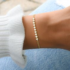 "Super chic bracelet, that is beautiful and minimalist. Adds a nice touch of sparkle, while still being classy! It looks great stacked or on its own! Features 10 CZ Bezels with a double chain for a unique look! - - D E T A I L S - - ▪︎ Made of 925 Sterling Silver ▪︎ We use a Thick plating of 14k Gold or Rhodium ▪︎ Measures 6.5\" + 0.5\" Extension Chain ▪︎ 3.5mm Bezel, 10 stones total ▪︎ Lobster Clasp Closure ▪︎ Nickel-free, lead free and hypoallergenic ▪︎ Highest Grade CZ for an authentic diamon Ring Redesign, Double Chain Bracelet, Round Bracelet, Small Gold Hoop Earrings, Small Gold Hoops, Cubic Zirconia Bracelet, Chic Bracelet, Gold Armband, Minimalist Bracelet