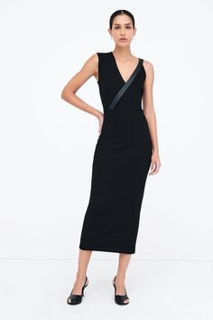 Dress outside the lines with our Carlton Dress, an elegantly unique sheath silhouette. Her asymmetrical design features one wide shoulder and a slender faux leather strap (wide enough to conceal bra straps) that continues down to define her waist. Crafted from structured, mid-stretch European ponte with a hidden side zip for easy on/off. [SPLIT] Astrid is 5'9" (175 cm) tall, wearing size XS. Total length approximately 49.5" (125.5 cm). European Ponte, also known as Punto di Roma (60% Viscose, 30 Sleek Bodycon Dress With Asymmetrical Neckline, Elegant Asymmetrical Midi Dress For Club, Modern Black Midi Dress For Party, Chic Asymmetrical Midi Dress For Club, Club Midi Dress With Asymmetrical Neckline, Sleek Asymmetrical Bodycon Dress, Fitted Black Dress With Strap Detailing, Black Fitted Dress With Strap Detailing, Modern Black Bodycon Dress For Party