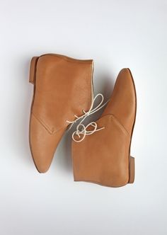 Light brown leather ankle boots. This pair is the ultimate classic, casual elegance. We made our boots to achieve comfort, durability and high aesthetics.  * Standard fit & generally runs true to size * The design is super flattering on all feet shapes and sizes * Leather lining with leather soles (3mm) & anti slip rubber heels (6mm) ✒︎ ✒︎ ✒︎ SHIPPING UPDATE (from Sept. 2022) for customers outside of Germany; if you would like to place an order for more than one pair; please place an order for each pair of shoes separately. Due to our delivery service size restriction we can only ship one pair of shoes per order (outside of Germany). Shipping to the US & UK are free. For more info please message us!  * Image no.2 is in Cognac brown colour and is for reference only.  * * * To make your orde Leather Ankle-high Chukka Boots For Fall, Fall Ankle-high Chukka Boots With Leather Footbed, Vegetable-tanned Leather Chelsea Boots With Round Toe, Fall Leather Footbed Ankle-high Chukka Boots, Classic Ankle-high Lace-up Boots With Leather Sole, Fall Vegetable-tanned Plain Toe Boots, Classic Lace-up Boots With Almond Toe For Fall, Classic Round Toe Booties For Fall, Fall Leather Ankle Chukka Boots