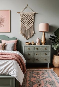 a bedroom with pink and green decor on the walls, bedding and rugs