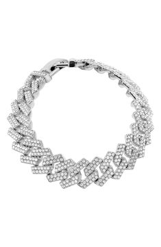 Pavé cubic zirconia bring glamorous sparkle to a curb-chain bracelet with a polished rhodium-plated finish. 8 1/2" length; 1/2" width Fold-over clasp White rhodium plate/cubic zirconia Imported Silver Diamond Chain Bracelets, Silver Diamond Link Bracelet, Silver Chain Link Diamond Bracelet For Formal Occasions, Formal Silver Chain Link Diamond Bracelet, Iced Out Crystal Chain Link Jewelry, Elegant Silver Diamond Bracelet With Curb Chain, Elegant Silver Diamond Curb Chain Bracelet, Silver Cuban Link Bracelet With Diamond Accents, Diamond Cuban Link Chain Bracelet In Silver