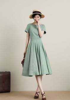 "DETAILS * 50% linen, 50% cotton blend * Has no lining * Two side Seam pockets * Boat neckline swing dress * High waist flared midi dress, Fitted waistband * Back zip closure * Perfect for Summer, Spring, autumn * Wash by hand or machine with cold water, Ironing after dry * The model is 170cm (5′7″) tall with a 80cm (31.5\") bust, 66cm (26\") waist. She is wearing the green dress in size XS. CUSTOM MADE SERVICE If you * Change other color * Can't find your size in our size Chart * Change the Len Vintage Dresses Modest, Vintage A-line Dress With Pockets, Vintage Solid Color Midi Dress For Spring, Green Cotton A-line Vintage Dress, Cotton A-line Dress With Box Pleat, 1950s Style Summer Dresses, Solid A-line Vintage Midi Dress, Solid Vintage A-line Midi Dress, Solid Color A-line Vintage Midi Dress