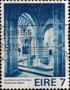 a postage stamp with an image of a bath in a room that is surrounded by columns and arches