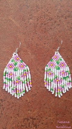 These handmade unique earrings with abstract floral print are made of high-quality Czech beads and strong synthetic thread. I use my author's scheme . These earrings are elegant, fashionable, and highly versatile, suitable for everyday wear. Color: white,pink, green, yellow . 100% hand made with love! Measurements: Length-about 7cm (with schwenze) , Width -3 cm Materials: Silver plated ear hooks Czech glass beads Nylon Thread Traditional White Flower Earrings, White Dangle Flower Earrings With Colorful Beads, White Flower Dangle Earrings With Colorful Beads, White Beaded Adjustable Flower Earrings, White Flower Shaped Beaded Earrings With Colorful Beads, White Handmade Bohemian Earrings, White Dangle Flower Earrings With Beads, Handmade White Bohemian Earrings, Traditional White Earrings With Ear Wire