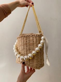 Elegant Natural Color Shoulder Bag, Elegant Straw Shoulder Bag, Beige Rectangular Bucket Bag For Party, Elegant White Bucket Bag With Pearl Handle, Elegant Natural Bucket Bag For Evening, Elegant Evening Straw Tote Bag, Elegant Natural Color Evening Bucket Bag, Beige Bucket Bag For Summer Evenings, Summer Beige Shoulder Bag With Pearl Handle