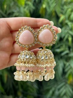 Beautiful engraved Jhumka earrings available in 2 stunning variations of pink. These earrings are high quality and are made to last. They are not too heavy and will be fine to wear all day long. They surely add a statement to any look! In case of any queries, please feel free to reach out. Happy shopping! Luxury White Jhumkas With Latkans, Luxury Fusion Style Chandelier Earrings With Latkans, Luxury Tilla Jhumkas For Eid, Luxury Hallmarked Fusion Jhumkas, Luxury Jhumkas With Stone Work For Festivals, Luxury Ornate Jhumkas For Festivals, Cheap Jhumkas For Diwali Celebration, Luxury Hand Set Jhumkas For Diwali, Luxury Jhumkas With Intricate Design For Anniversary