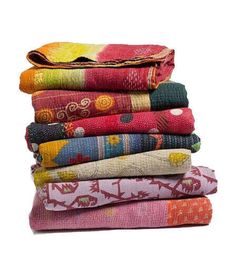 a stack of colorful towels sitting on top of each other