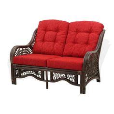 a red couch sitting on top of a wooden frame