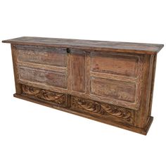 an old wooden sideboard with carvings on the front and sides, isolated against a white background