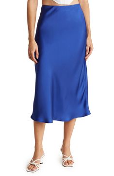 Elevate your wardrobe with this pull-on bias satin midi skirt for elegant, feminine style. 31" length (size S) Elasticized waist Pull-on style Satin construction 97% polyester, 3% spandex Machine wash cold, line dry Made in USA Model’s stats for sizing: 5’10” height, 34” bust, 27” waist, 35” hips. Model is wearing size S. Navy Satin Midi Skirt, Elegant Feminine Style, Midi Slip Skirt, Blue Midi Skirt, Business Skirt, Navy Blue Skirt, Lace Midi Skirt, Midi Flare Skirt, Skirt Trends