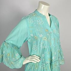 This stylish tunic is an ideal addition to any summer outfit.  Crafted from 100% lightweight cotton, the garment has a trendy light turquoise/aqua color and features flower-like embroidery.  The tunic has 3/4 sleeves, which end in embroidered, flared cuffs. This tunic has a universal fit, similar to a European size Medium to Large. Before ordering, please check the size of the tunic with your personal sizes. Size: about European size Medium to Large - all measurements are approx. shoulder width: Stylish Tunic, Embroidered Tunic, Light Turquoise, Aqua Color, Womens Tunics, Flared Sleeves, Tunic Dress, Womens Clothing Tops, Summer Outfit