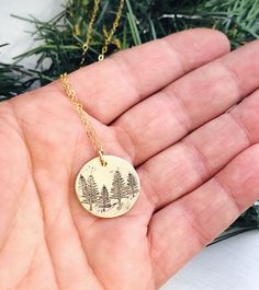 "Tree Necklace - Forest Necklace - Gift for Her - Stocking Stuffer - Winter Birthday Necklace - Pine Tree Necklace - Evergreen Jewelry 5/8\" brass disk is stamped with little pine trees, and given a rustic finish. It hangs from a dainty gold filled cable chain." Personalized Nature-inspired Charm Necklace For Gifts, Green Pendant Jewelry For Birthday, Handmade Green Necklaces For Birthday Gift, Green Engraved Jewelry As Gift, Handmade Green Necklace For Birthday Gift, Green Birth Flower Jewelry As Gift, Green Birth Flower Jewelry Gift, Green Birth Flower Jewelry For Gift, Personalized Round Nature-inspired Jewelry