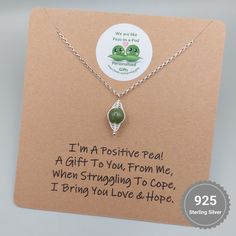 "I'm a Positive Pea, A Gift To You, From Me.  When Struggling To Cope, I Bring You Love & Hope" Express your love and affection in a unique way with this charming Positive Pea, pea pod necklace from Charming Gifts. The necklace is made from high-quality sterling silver metal, ensuring its durability and long-lasting shine. It features a beautiful round jade gemstone as the main stone, which brings good luck and positivity to the wearer. This necklace comes with a spring ring closure and a belche Inspirational Handmade Necklaces For Gifts, Inspirational Handmade Necklace For Gift, Inspirational Handmade Necklace Gift, Inspirational Sterling Silver Necklaces For Gifts, Inspirational Sterling Silver Necklace Gift, Inspirational Silver Necklace Gift Idea, Inspirational Silver Necklace Gift, Inspirational Sterling Silver Necklace As Gift, Meaningful Sterling Silver Jewelry