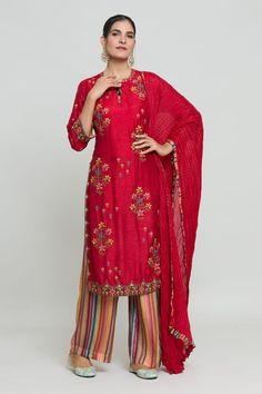 Red kurta with multicolored thread work. Paired with a striped palazzo. - Aza Fashions Designer Red Unstitched Suit With Resham Embroidery, Designer Red Unstitched Suit In Raw Silk, Red Chanderi Unstitched Suit With Resham Embroidery, Red Cotton Silk Unstitched Suit For Eid, Red Cotton Silk Unstitched Suit With Straight Kurta, Red Slub Silk Unstitched Suit For Festivals, Red Slub Silk Unstitched Suit With Resham Embroidery, Red Cotton Silk Unstitched Suit For Festivals, Red Slub Silk Unstitched Suit For Navratri