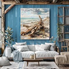 a living room filled with furniture and a painting on the wall above it's couch