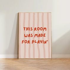 this room was made for playin'poster in pink and red with the words, this room was made for playin '