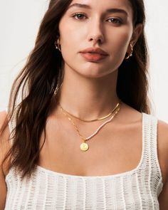 Our Pearl alphabet necklaces show the essence of individuality, with each letter carefully carved to represent a different flower, symbolizing unique qualities and meanings. This elegant pearl necklace combines the timeless elegance of pearls, known for their purity, wisdom and wealth, with a personalized floral engraving on a yellow gold pendant that embodies personal meaning and natural beauty. Whether for personal use or as a gift, this necklace is a daily reminder of personal growth and the Spiritual Style Pearl Pendant Necklace, Gold Shell Necklace With Pearl Pendant As Gift, Elegant Gold Pearl Necklace With Initial Pendant, Luxury Gold Spiritual Pearl Necklace, Spiritual Gold Necklace With Mother Of Pearl, Floral Engraving, Perfume Jewelry, Alphabet Necklace, Yellow Gold Pendants