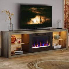 a tv stand with a fire place in front of it