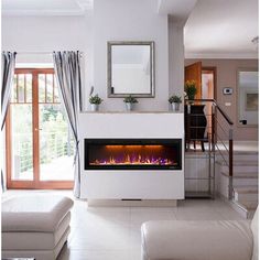 a living room with a fire place in the center