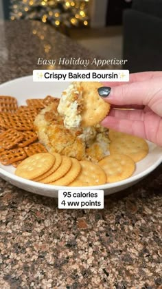 a plate with crackers, cheese and crackers on it that says easy holiday appetizer crispy baked borsin