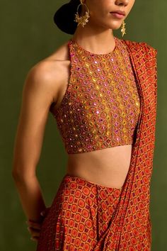 Orange pre draped saree with geometric print. Comes with dabka embroidered halter neck padded blouse, embellished by sequins, beads and mirrorwork. - Aza Fashions Multicolor Sequined Blouse For Wedding, Transitional Blouse With Mirror Work For Reception, Fitted Embellished Multicolor Traditional Wear, Embellished Fitted Saree, Elegant Embellished Multicolor Blouse, Multicolor Sequin Wedding Blouse, Festive Embellished Fitted Blouse, Designer Embellished Art Silk Blouse, Multicolor Embellished Saree For Reception