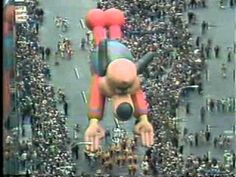 an inflatable balloon floats over a crowd of people