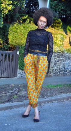 "Joggers in African print with mustard and orange as the primary colours. It has deep side pockets and the fit is relaxed with an elasticated waist making sizing flexible. Model 5ft9\" and wears a UK 10/12.  Belt available in shop to order. Length- 40\" 100% cotton  Made in Ghana Fabric care  Wash in cool water. Iron on medium heat.  Dry away from sunlight." Yellow Ankle-length Pants With Elastic Waistband, Casual Yellow Harem Pants With Loosely Fitted Hips, Casual Yellow Harem Pants With Pockets, Casual Yellow Harem Pants Loose Fit, Casual Yellow Loose Fit Harem Pants, Casual Yellow Ankle-length Harem Pants, Yellow Pants With Side Pockets, Yellow Straight Pants With Elastic Waistband, Yellow Pants With Elastic Waistband