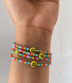 Rainbow with yellow smiley Rainbow Bracelet Beads, Trendy Everyday Bracelet With Smiley Face, Trendy Everyday Bracelets With Smiley Face, Trendy Everyday Smiley Face Bracelet, Everyday Beaded Bracelets With Smiley Face, Casual Adjustable Smiley Face Friendship Bracelets, Multicolor Casual Smiley Face Bracelets, Casual Smiley Face Friendship Bracelets, Casual Adjustable Smiley Face Bracelets