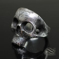 The Skull ring, A simple yet powerful look. Each one is hand carved, cast and then refined again to achieve the desired look. For this reason, there will be subtle differences in each ring. These take Time, please allow 1-2 weeks for your order to ship as I will make your ring to order in your size. Please select from the list of options: 1. Ring Size 2. Ring Metal Metal: Please select from Sterling Silver, 14k white gold or 14k yellow gold. These rings are heavy and thick. I do not skimp on my materials nor do I hollow out my rings. Interested in a larger size, or a different type of metal? Please just send me a message. Please allow several weeks for me to custom make your ring. These rings are a special order and cannot be exchanged however, I can resize them if needed. Shipping will in Classic Sterling Silver Hand Cast Rings, Classic Hand Cast Sterling Silver Rings, Formal Hand Cast Sterling Silver Rings, Classic Sterling Silver Skull Ring With Polished Finish, Hand Forged Sterling Silver Rings For Formal Occasions, Symbolic Hand Forged Sterling Silver Rings, Formal Hand Forged Sterling Silver Rings, Classic White Gold Skull Ring In Sterling Silver, Classic White Gold Sterling Silver Skull Ring