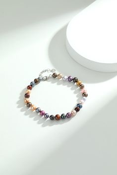 Experience the charm of our Multicolored Pearl Bracelet. Featuring 6-7mm nearly round pearls on a sleek chain, this bracelet combines the allure of varied hues with a modern design. An adjustable extension chain ensures a perfect fit for any wrist, making it a versatile and colorful addition to your jewelry collection. Elegant Multicolor Pearl Bracelets, Elegant Multicolor Pearl Beaded Bracelets, Elegant Multicolor Beaded Pearl Bracelet, Elegant Multicolor Round Beads Bracelet, Multicolor Pearl Bracelets With Round Beads, Multicolor Beaded Pearl Bracelet, Elegant Multicolor 8mm Beads Bracelets, Elegant Multicolor 8mm Beaded Bracelets, Multicolor Pearl Bracelet With 8mm Round Beads