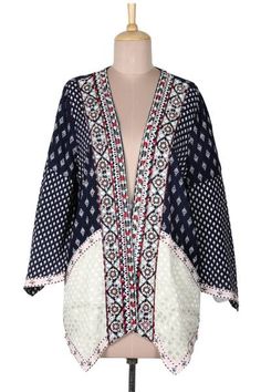 Mixed prints in white and light pink on midnight blue become a stylish open jacket with bohemian flair. Designed by India's Anchal Ahuja the jacket features a handkerchief hem and sleeves and a lavishly embroidered neckline and front placket with accents of red and green as well as tiny mirrored discs. Summer Long Sleeve Outerwear With Boho Print, Summer Boho Print Long Sleeve Outerwear, Summer Long Sleeve Boho Print Outerwear, Bohemian Printed Summer Outerwear, White Bohemian Outerwear For Spring, Bohemian Patchwork Cardigan For Summer, Folk Style Summer Outerwear, Spring Folk Style Long Sleeve Kimono, Folk Style Long Sleeve Kimono For Spring