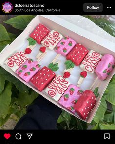 a box filled with strawberry shortcakes and marshmallow pops